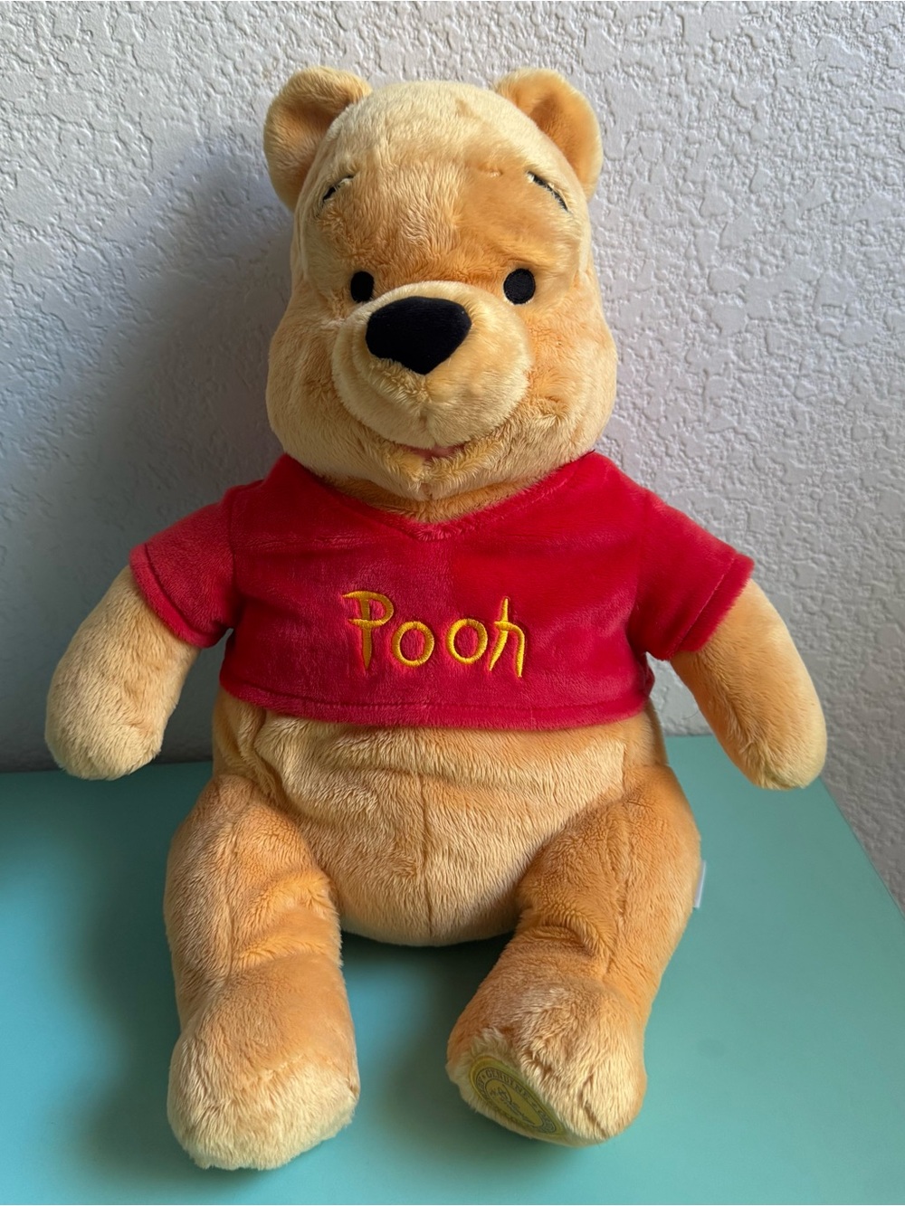 Like new Winnie the Pooh Plush – Yellow with Red Shirt Disney Storw